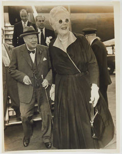 Photograph of Winston Churchill and wife deplaning