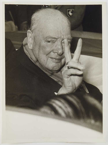 Photograph of Winston Churchill making the V sign to his constituency