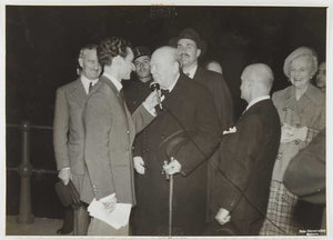 Photograph of Winston Churchill talking into microphone