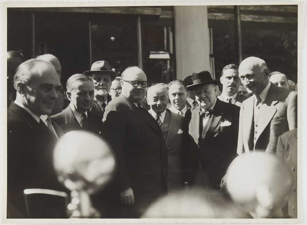 Photograph of Winston Churchill standing in a group
