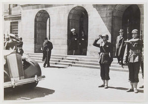 Photograph of Winston Churchill approaching a car