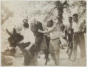 Photograph of Winston Churchill riding a donkey