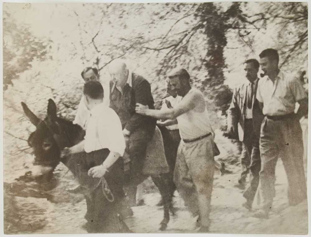 Photograph of Winston Churchill riding a donkey