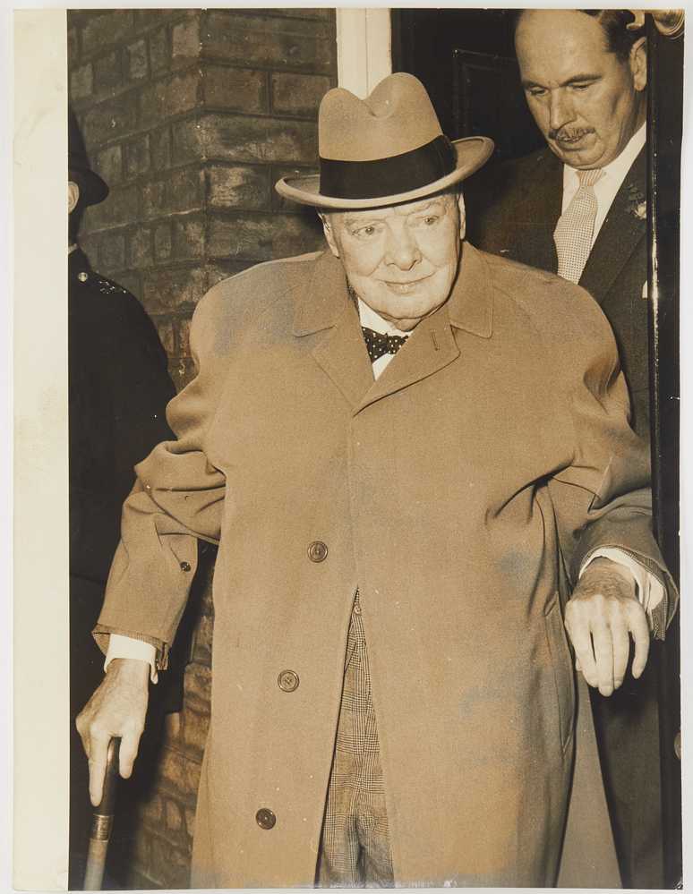Photograph of Winston Churchill in tan jacket and hat