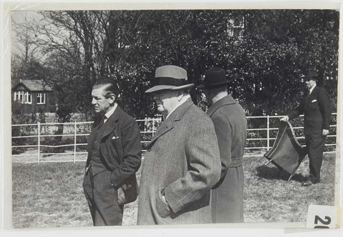Photograph of Winston Churchill and three other men in field