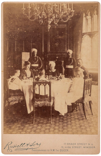 Cabinet photograph showing her with part of her family and two …